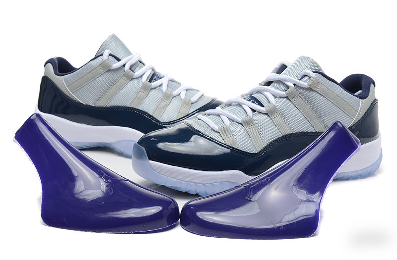 Air Jordan 11 Retro Low Sneakers, White and Navy - product image from the listing.