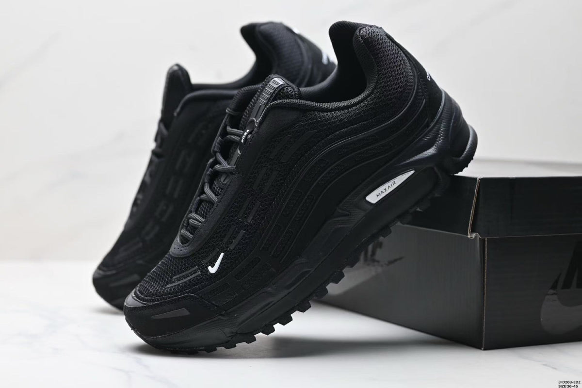 Nike Air Max Plus x Comme des Garçons Sneakers in Black - product image from the listing.
