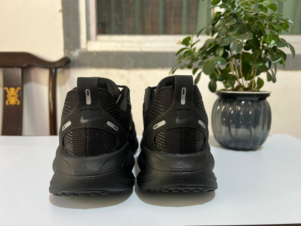 Nike Vomero 18 Running Shoes, in Black and Dark Gray - product image from the listing.