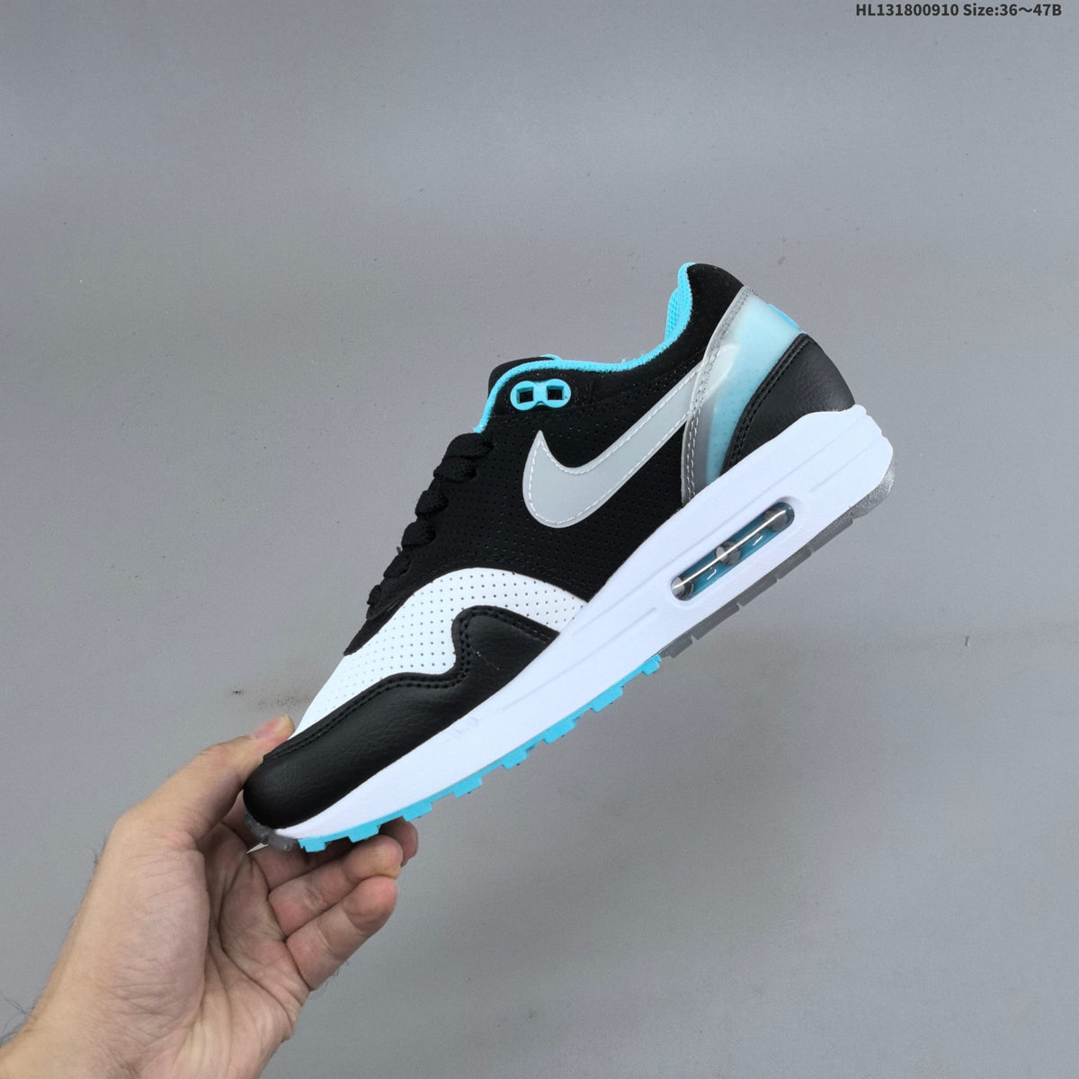 Nike Air Max 1 Sneakers in Black White and Turquoise - product image from the listing.