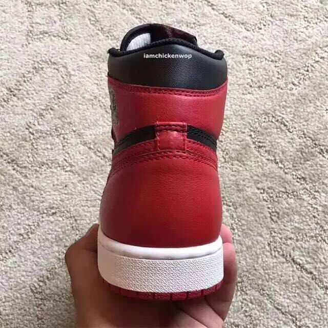 Air Jordan 1 High Sneakers in Black and Red - product image from the listing.