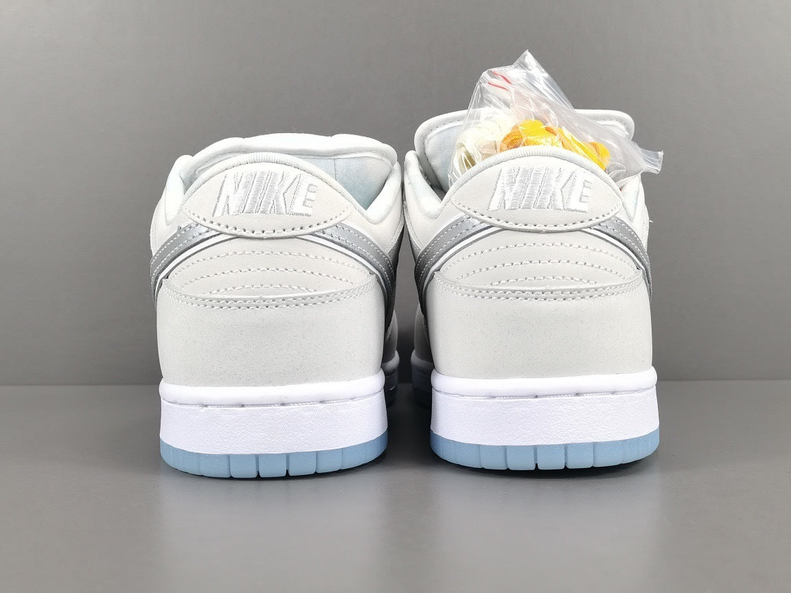 Nike Dunk Low SB Purple Lobster Sneakers in White FD8776-100 - product image from the listing.