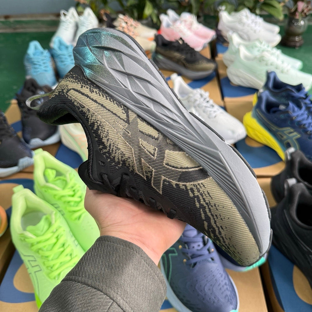 ASICS NOVABLAST 4 Running Sneakers in Black and Brown - product image from the listing.