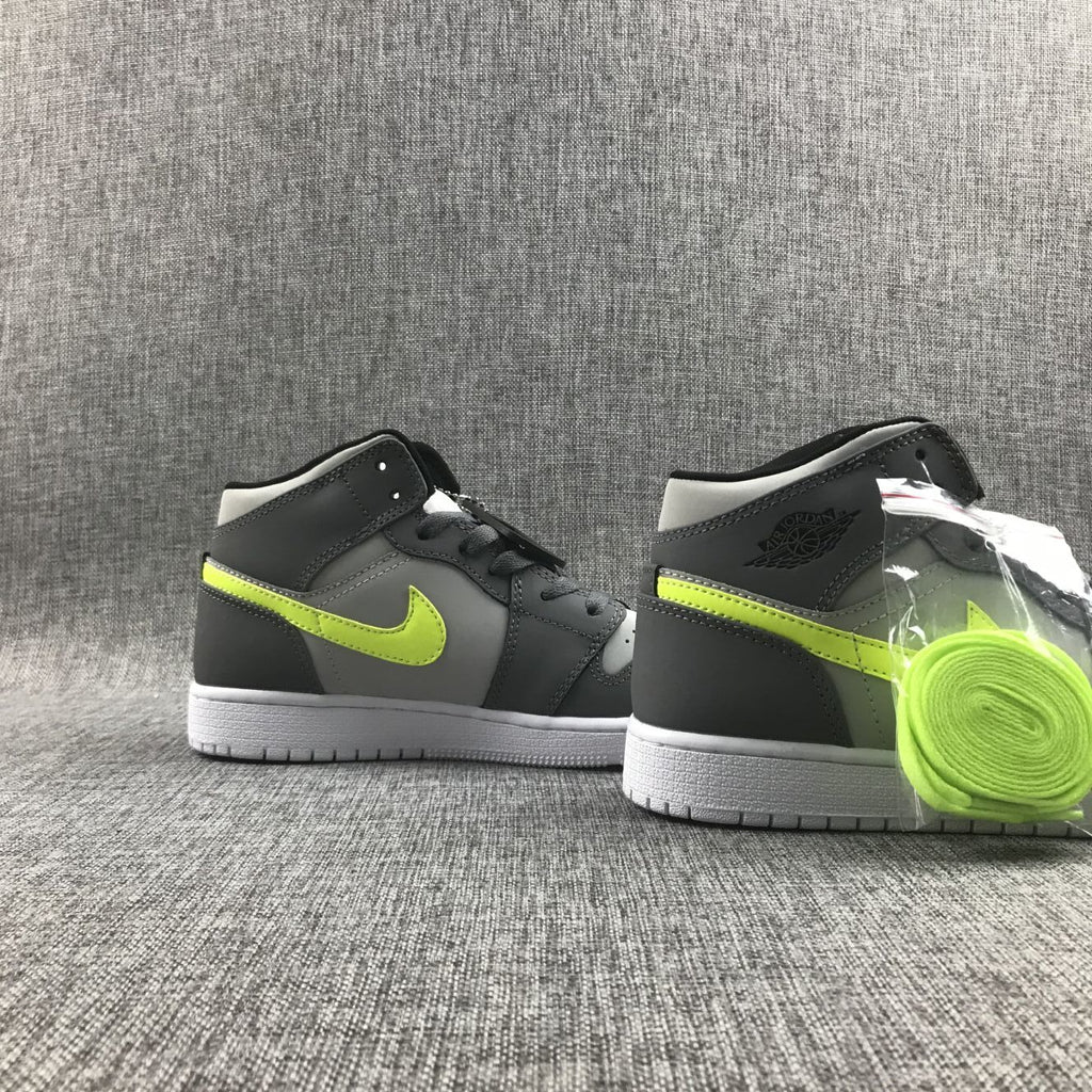 Air Jordan 1 Mid Sneakers in Grey Volt 554724-072 - product image from the listing.
