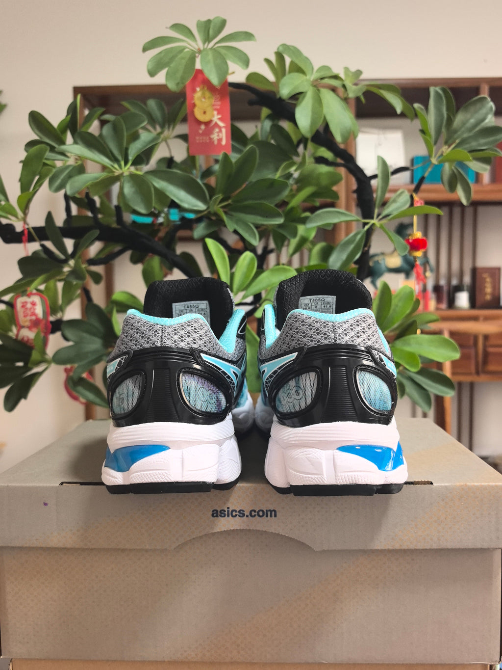 ASICS GEL-NIMBUS 16 Sneakers in Black, in Gray and Ice Blue - product image from the listing.