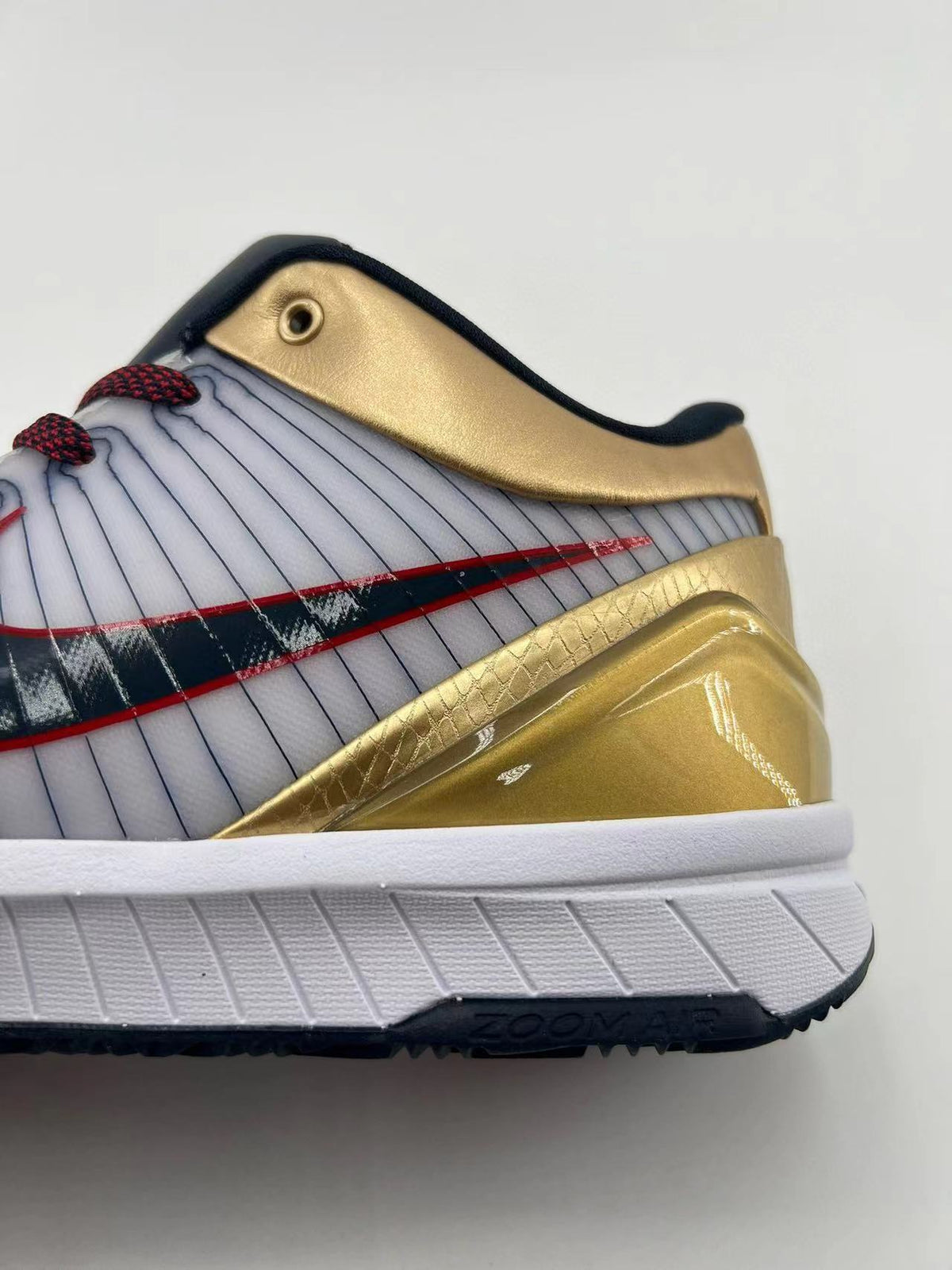 Nike Kobe 4 Protro Sneakers in Gold White 344335-141 - product image from the listing.