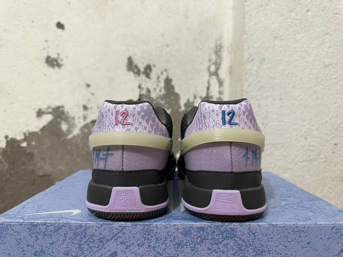 Nike Zoom GT Cut Academy Basketball Shoes in Black Purple - product image from the listing.
