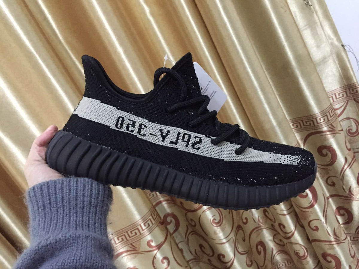 Adidas Yeezy Boost 350 V2 Sneakers in Black White - product image from the listing.