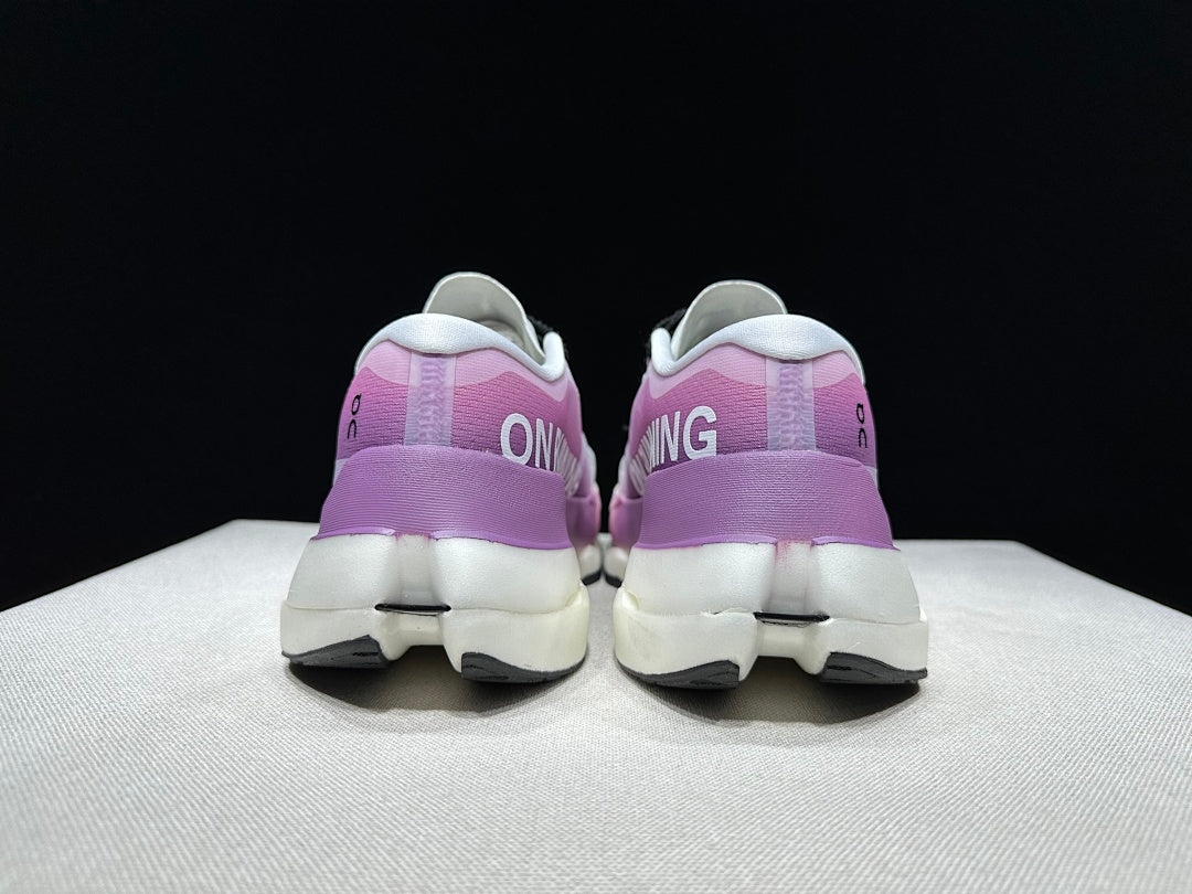 On Cloudboom Max Running Sneakers in White Purple - product image from the listing.