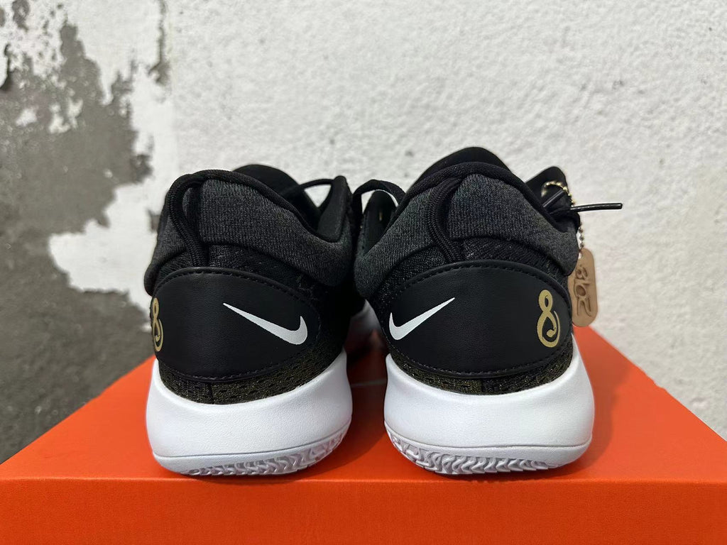 Nike Zoom Basketball Shoes in Black and Gold - product image from the listing.