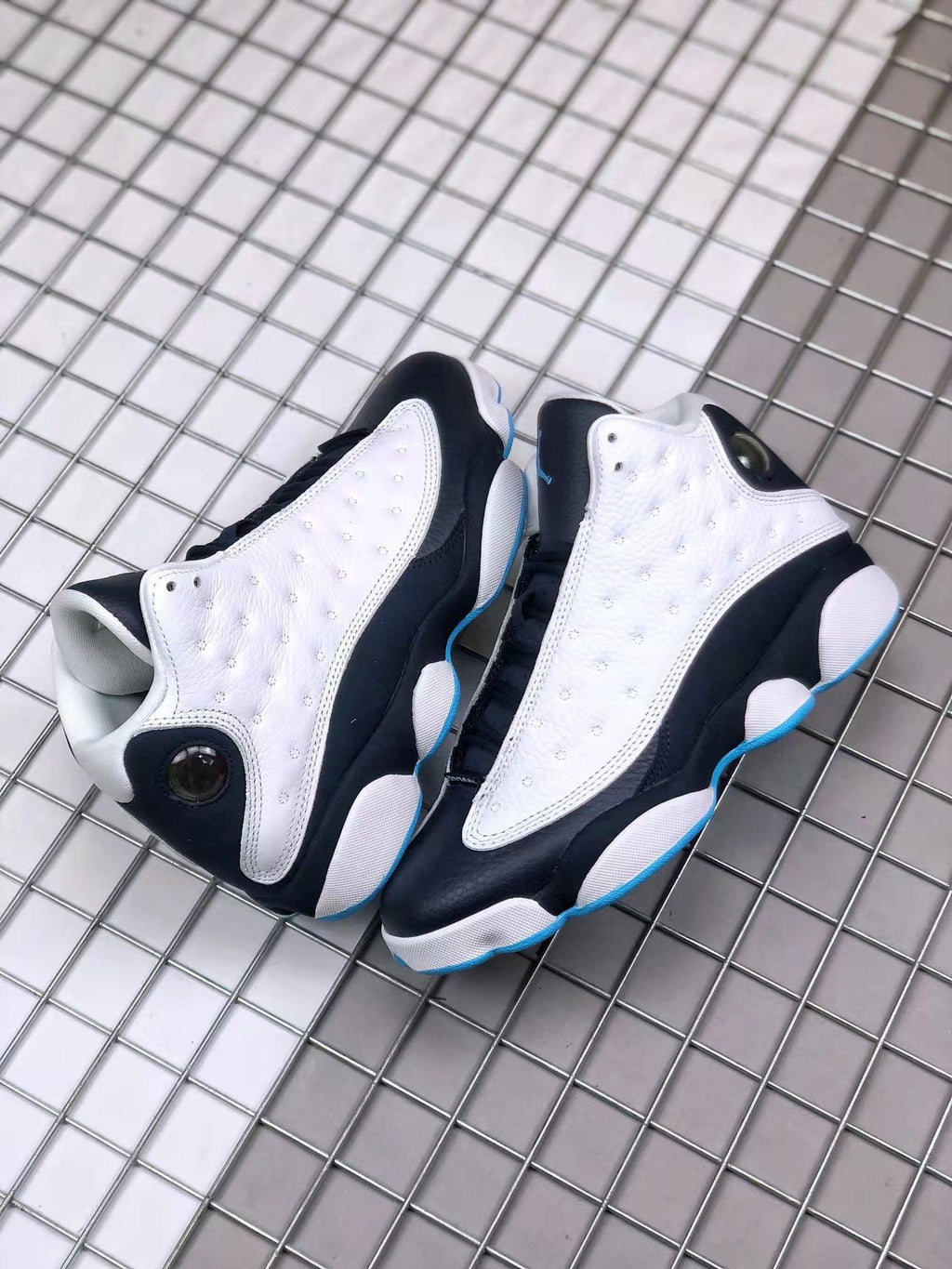 Air Jordan 13 Obsidian Sneakers 414571-144 - product image from the listing.