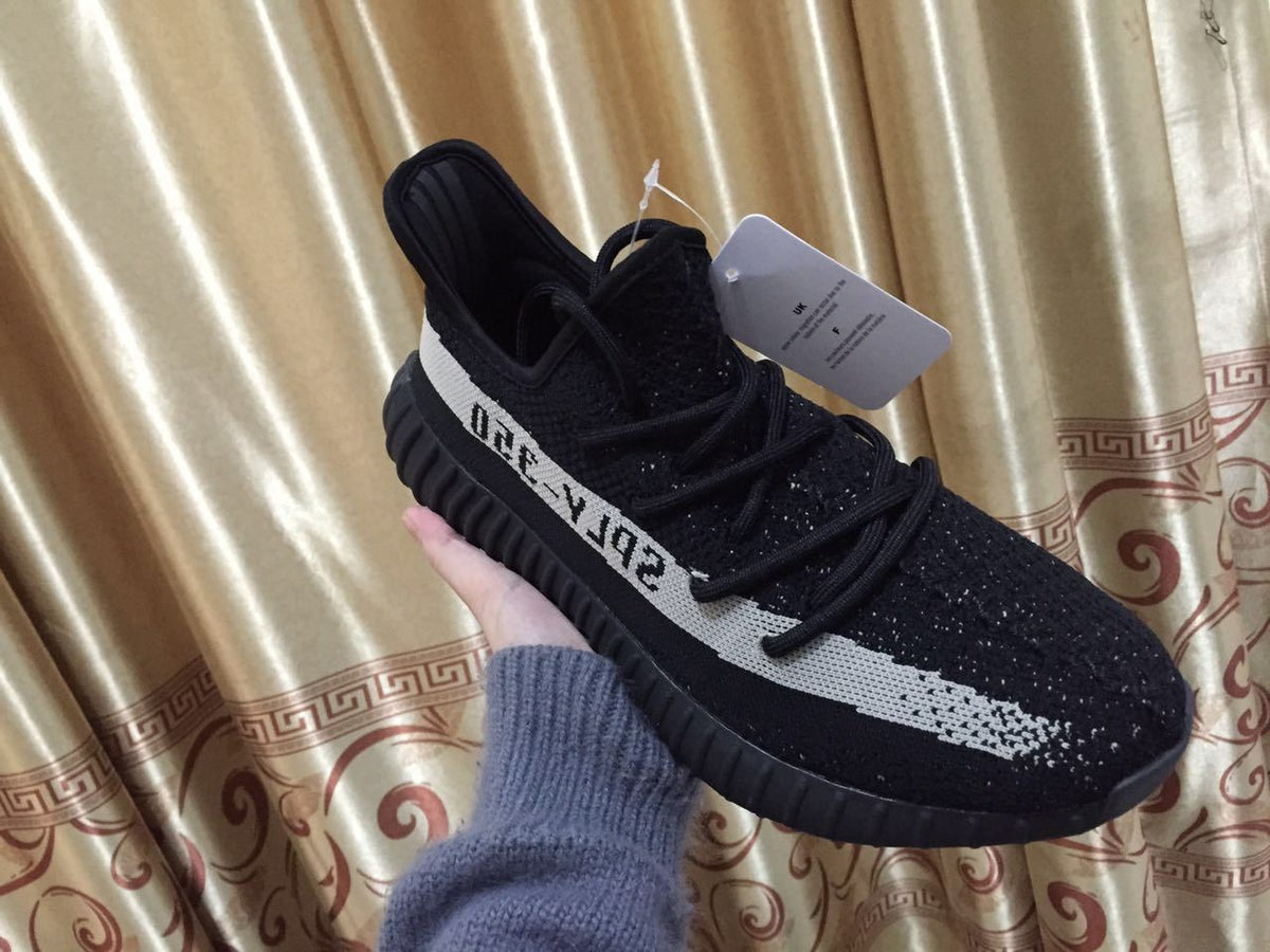 Adidas Yeezy Boost 350 V2 Sneakers in Black White - product image from the listing.