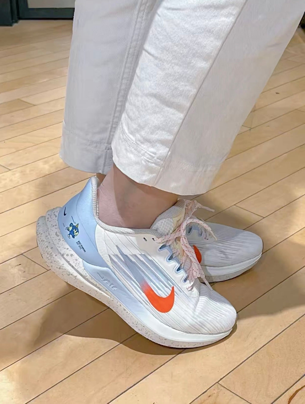 White and Light Blue Nike Air Winflo 9 Running Shoes DX6048-181 - product image from the listing.