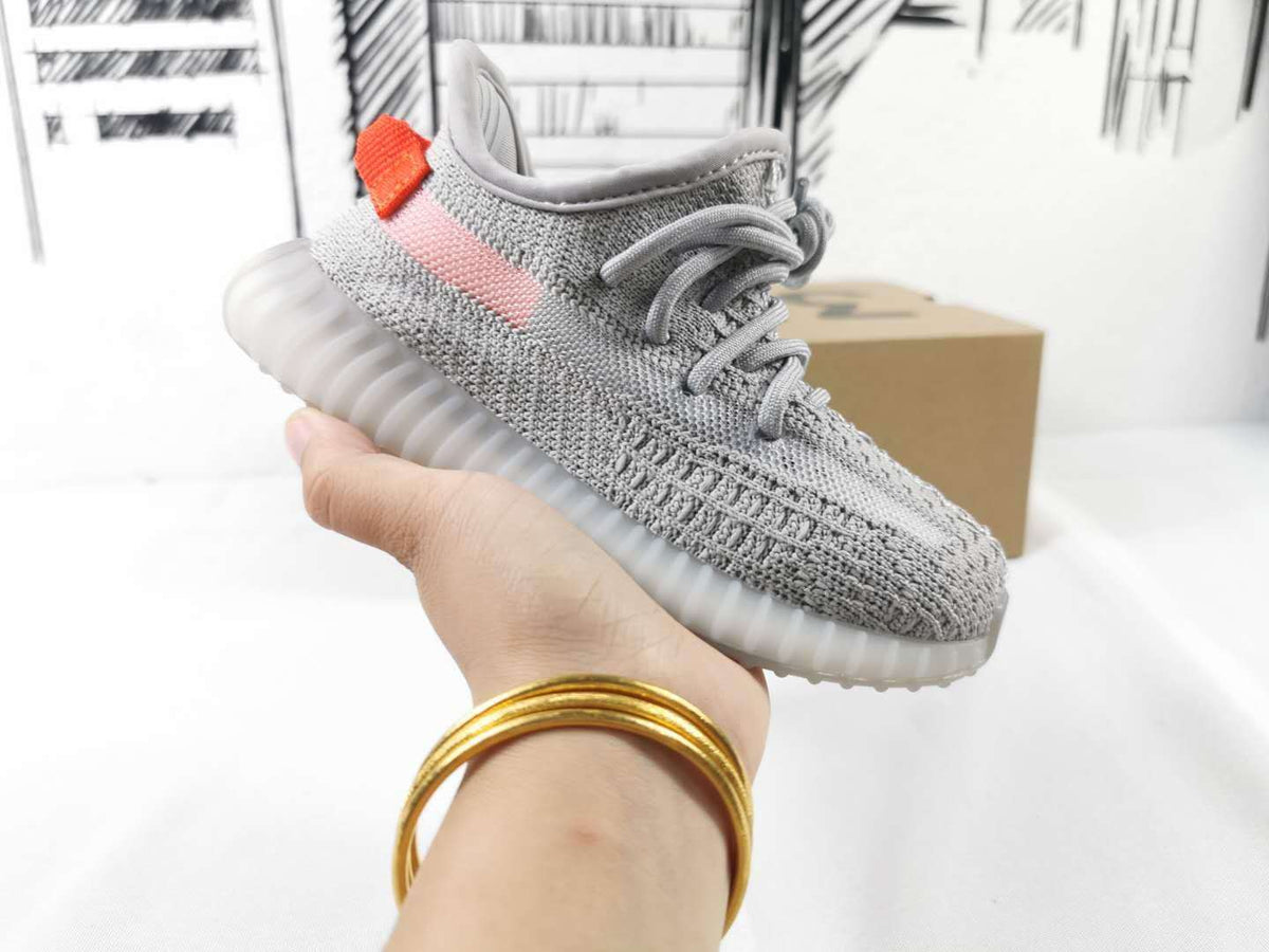Light Grey and Coral Yeezy 350 V2 Kids Sneakers - product image from the listing.