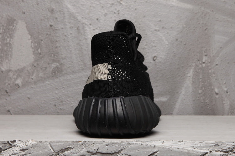 Yeezy 350 V2 Sneakers in Black and Cream Knit - product image from the listing.