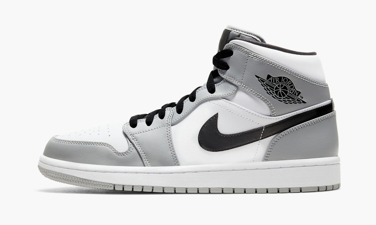 Air Jordan 1 Mid in Light Smoke Grey - product image from the listing.