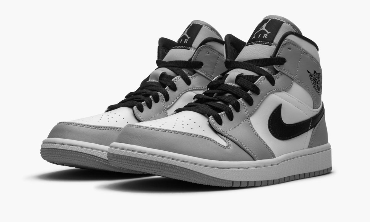 Air Jordan 1 Mid in Light Smoke Grey - product image from the listing.