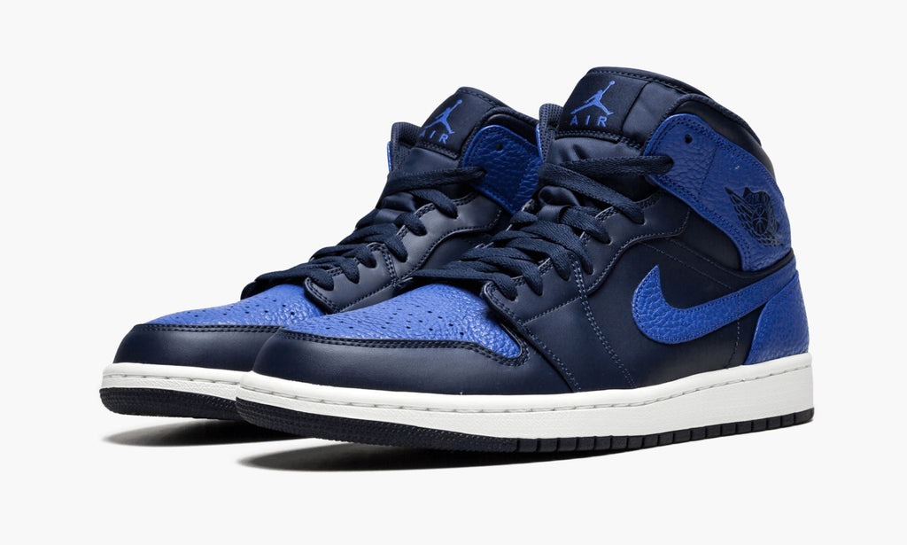 Air Jordan 1 Mid Obsidian in Royal - product image from the listing.