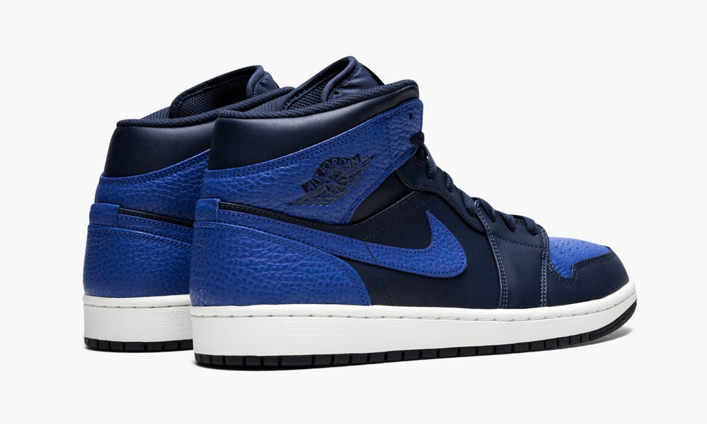 Air Jordan 1 Mid Obsidian in Royal - product image from the listing.