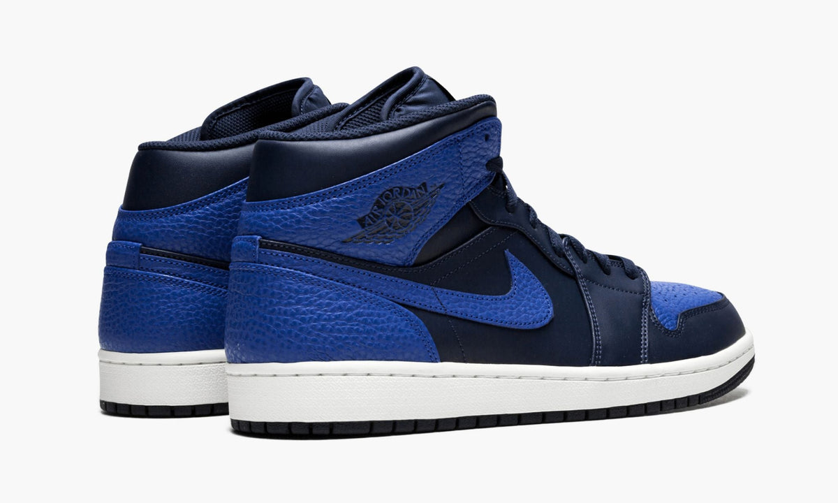 Air Jordan 1 Mid Obsidian in Royal - product image from the listing.