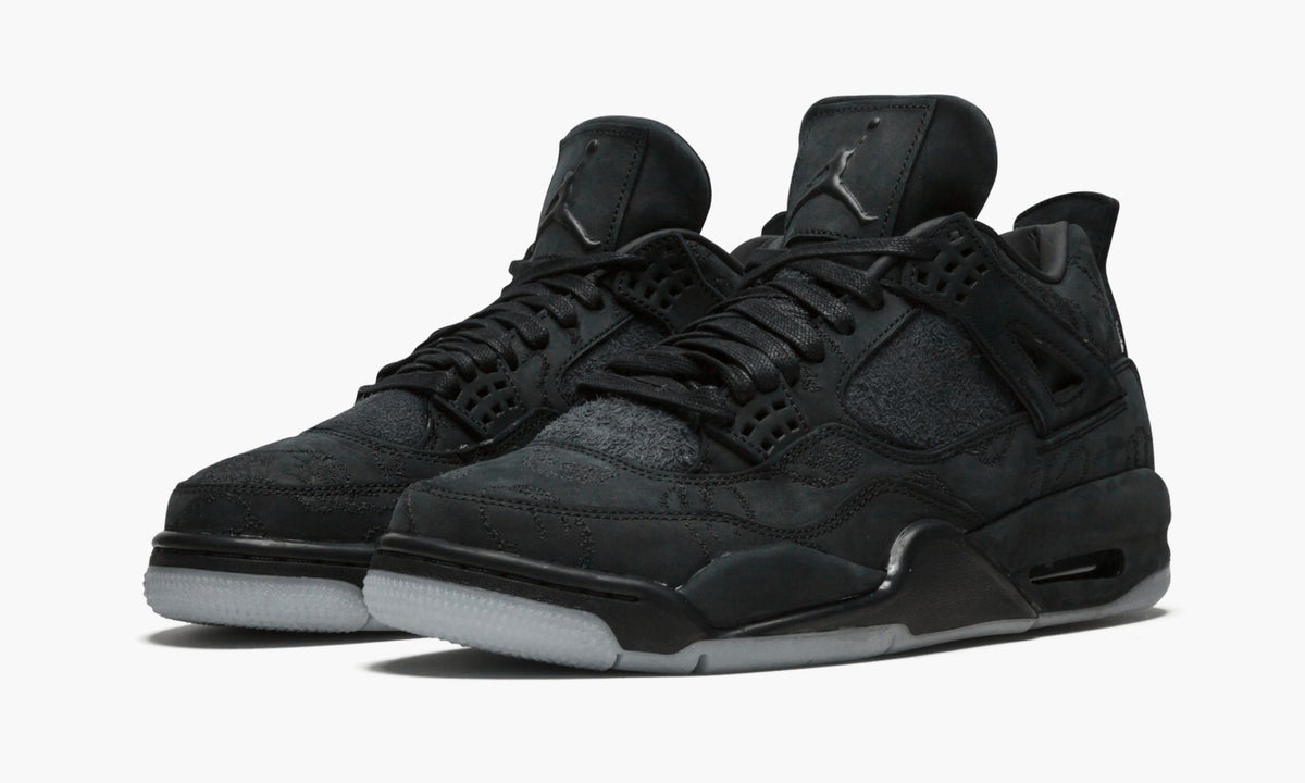 Air Jordan 4 Retro Kaws in Black - product image from the listing.