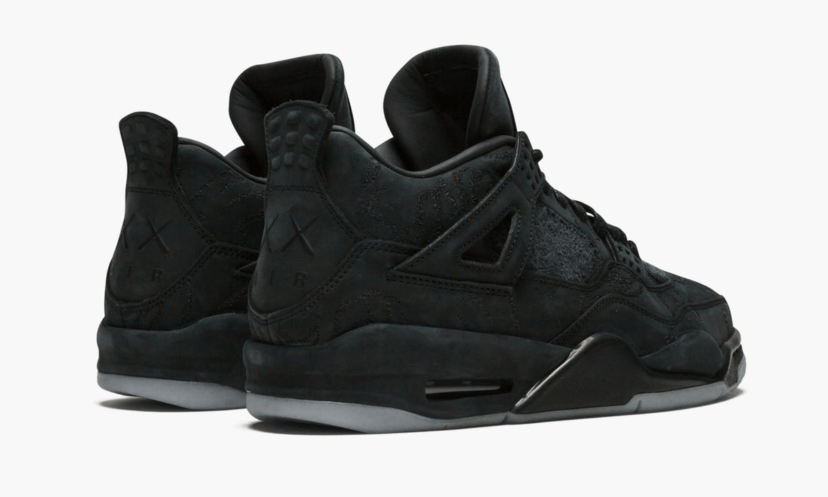 Air Jordan 4 Retro Kaws in Black - product image from the listing.
