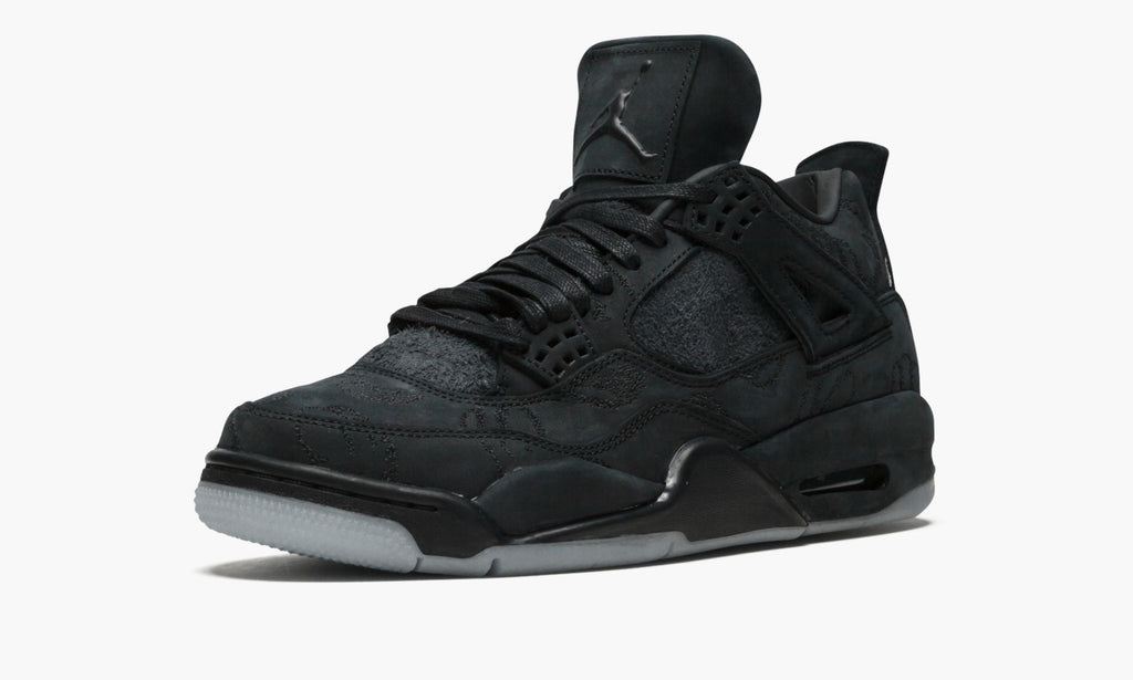 Air Jordan 4 Retro Kaws in Black - product image from the listing.