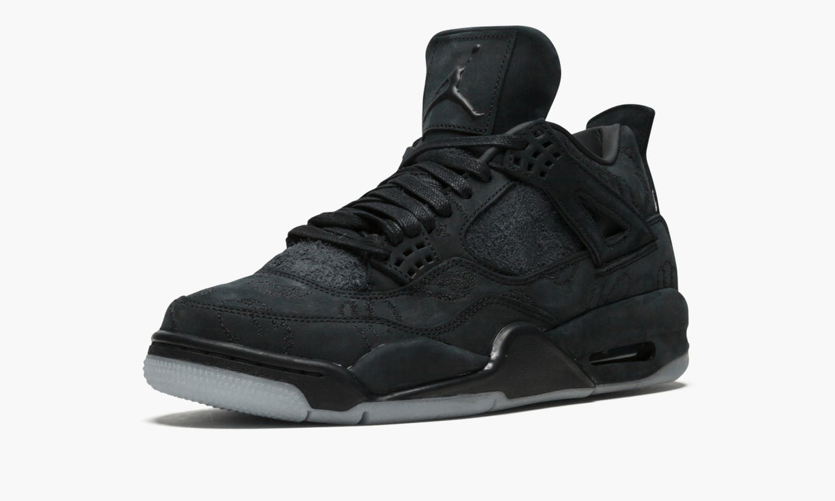 Air Jordan 4 Retro Kaws in Black - product image from the listing.