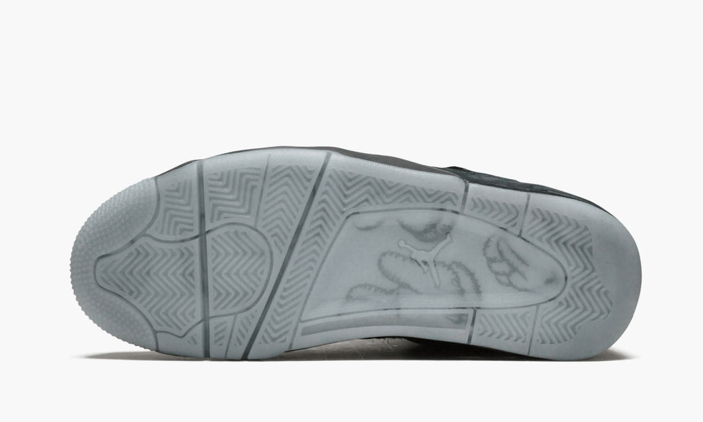 Air Jordan 4 Retro Kaws in Black - product image from the listing.