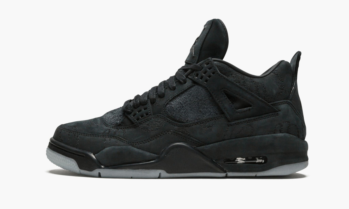 Air Jordan 4 Retro Kaws in Black - product image from the listing.