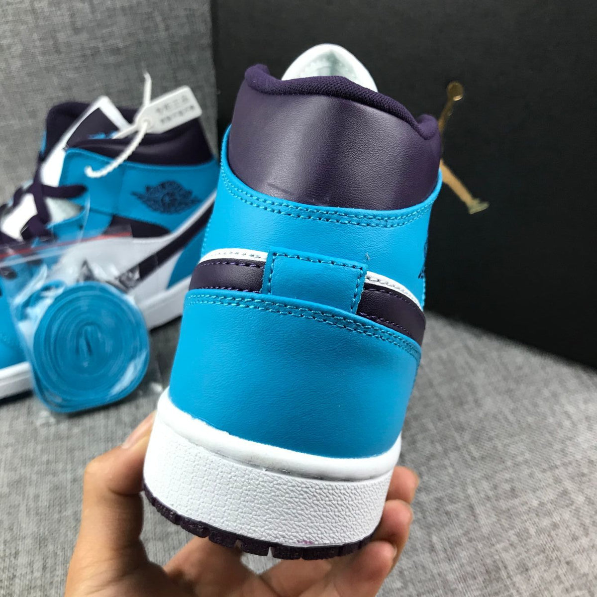 Air Jordan 1 Mid Sneakers in Blue, in White and Black - product image from the listing.