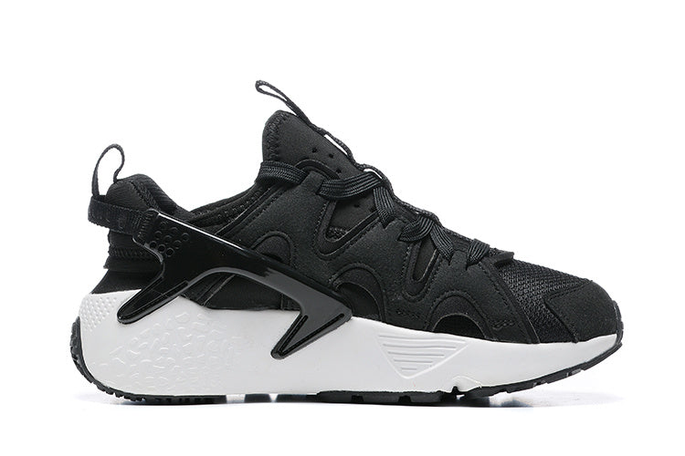 Nike Air Huarache Sneakers in Black and White - product image from the listing.