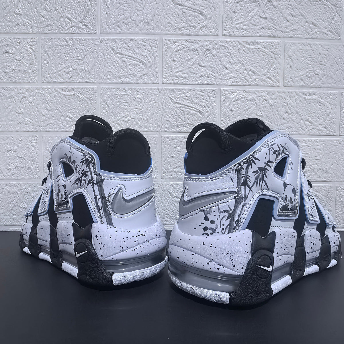Nike Air More Uptempo Panda Sneakers in Black and White - product image from the listing.