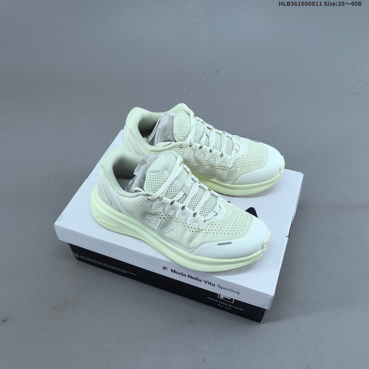 Ivory FILA Pebble Sandal Sneakers - product image from the listing.