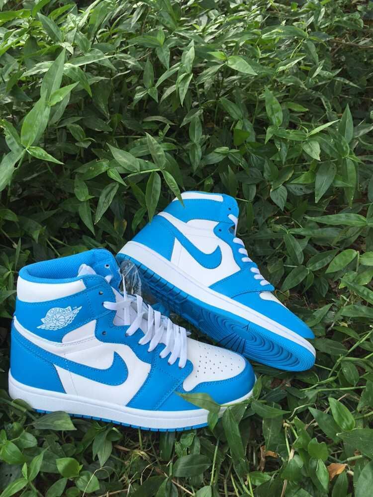 Blue and White Air Jordan 1 High Sneakers - product image from the listing.