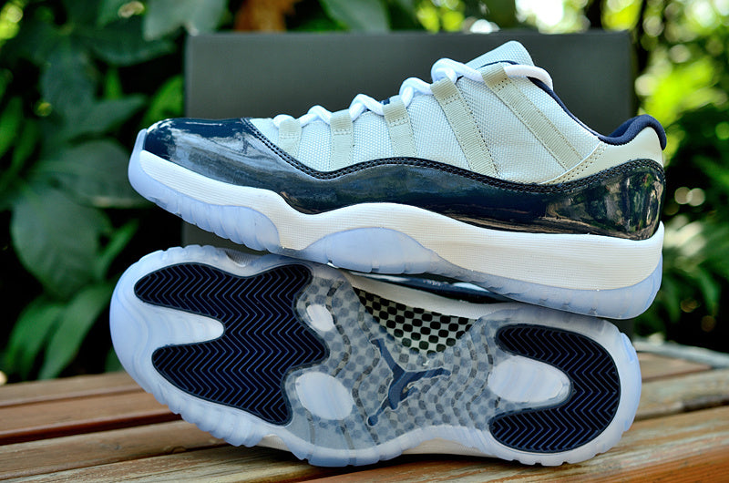 Air Jordan 11 Retro Low Sneakers, White and Navy - product image from the listing.