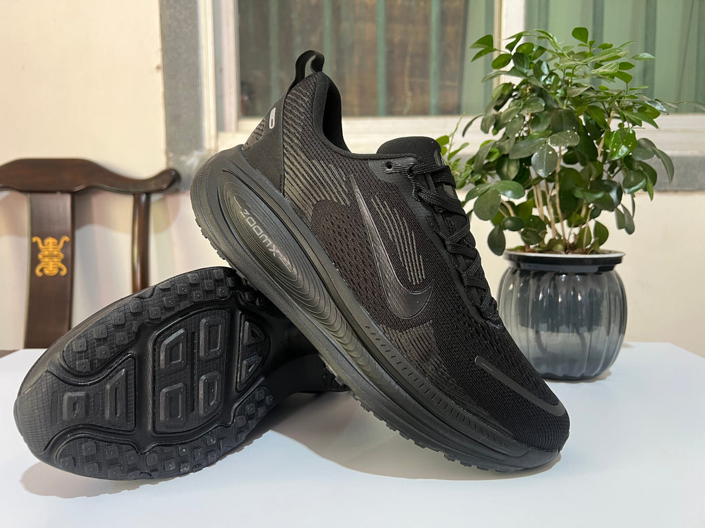 Nike Vomero 18 Running Shoes, in Black and Dark Gray - product image from the listing.