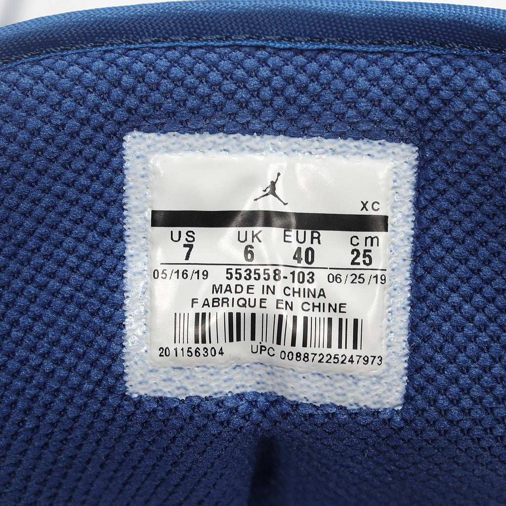 Jordan 1 Low Sneakers in White Grey Blue 553558-103 - product image from the listing.