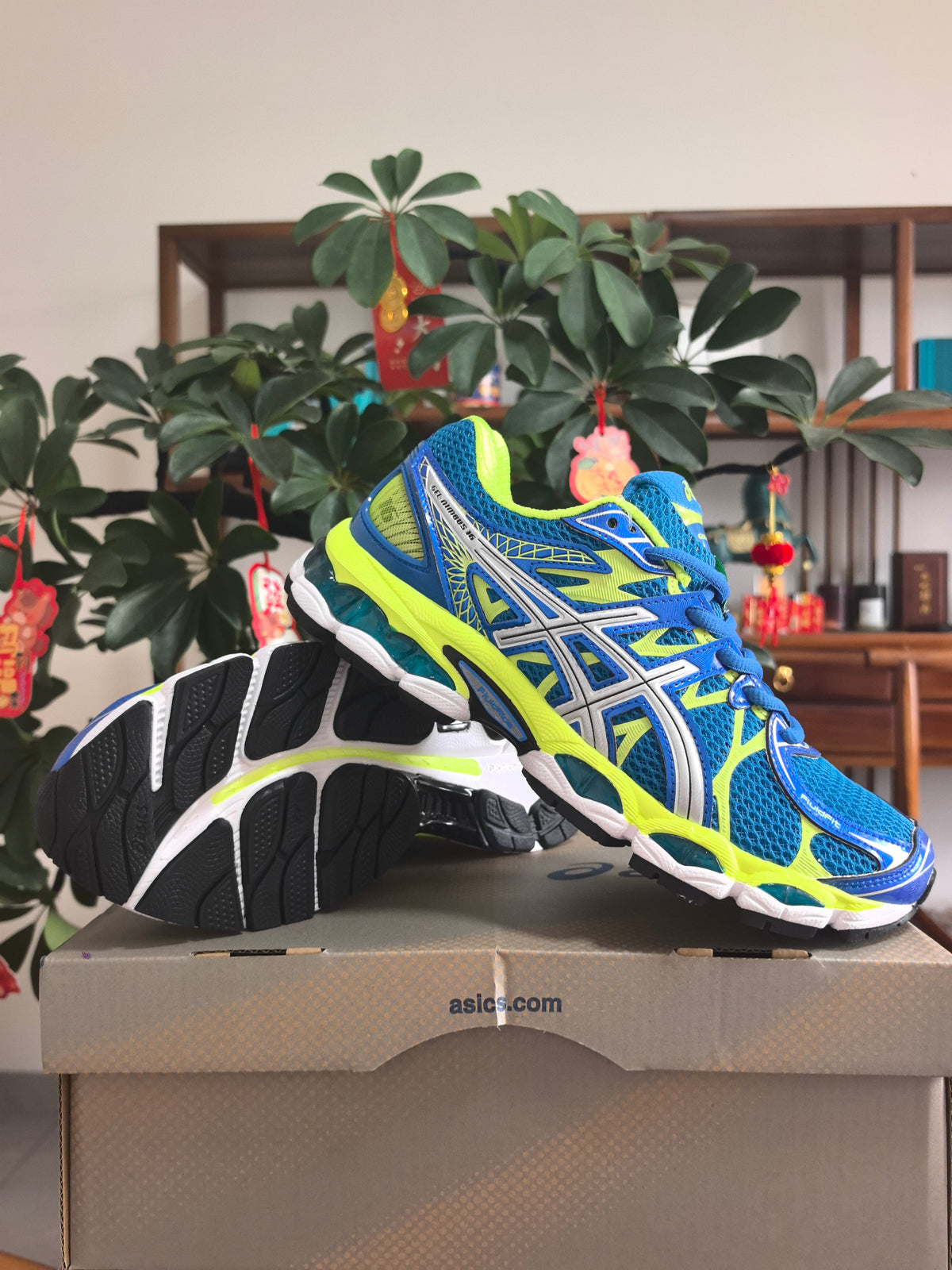 ASICS GEL-NIMBUS 16 Sneakers, Blue and Neon in Yellow - product image from the listing.