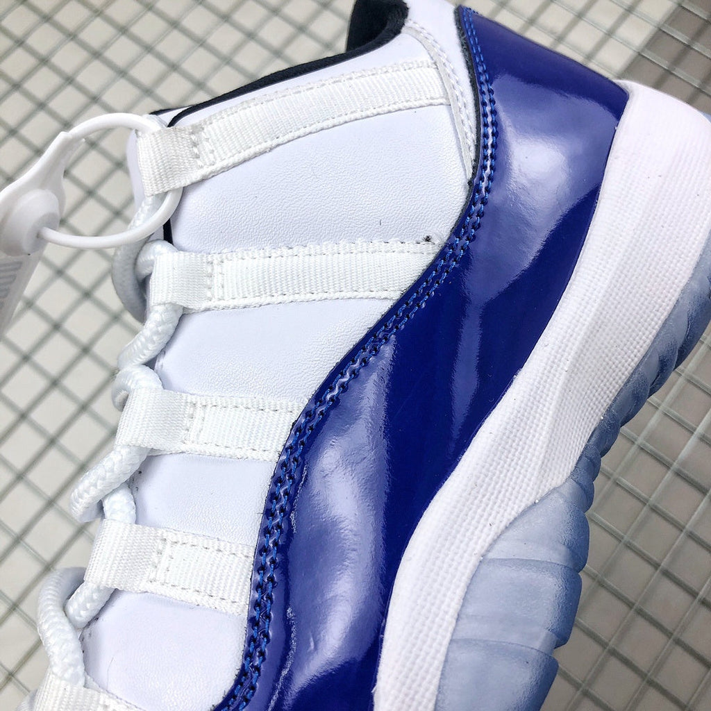 Air Jordan 11 Sneakers in White and Deep Blue BQ3685-001 - product image from the listing.