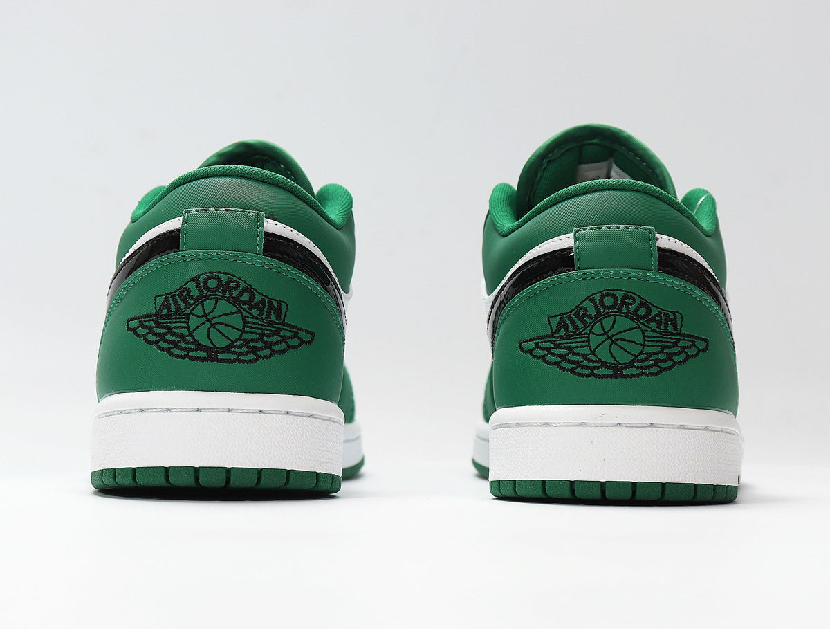 Jordan 1 Low Sneakers in White and Green 553558-301 - product image from the listing.