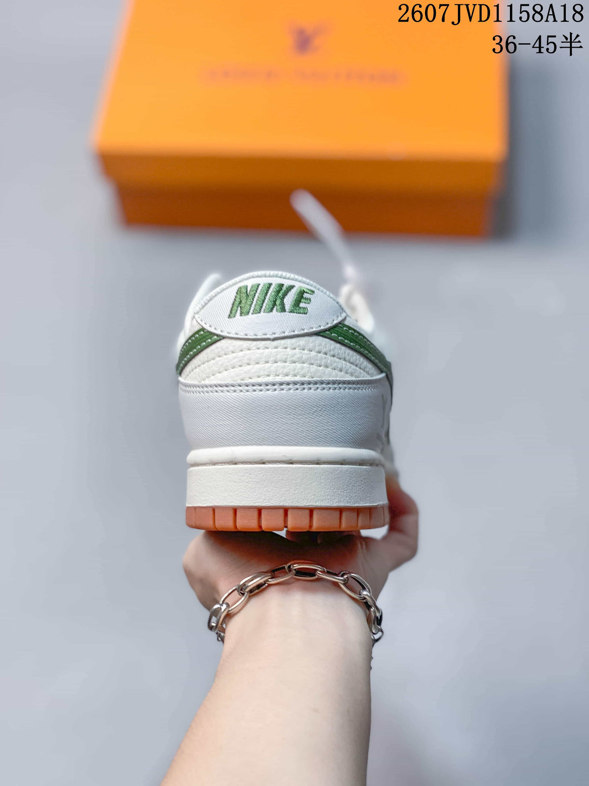 Nike SB Dunk Low Sneakers in White Green Gum 2607JVD1158A18 - product image from the listing.