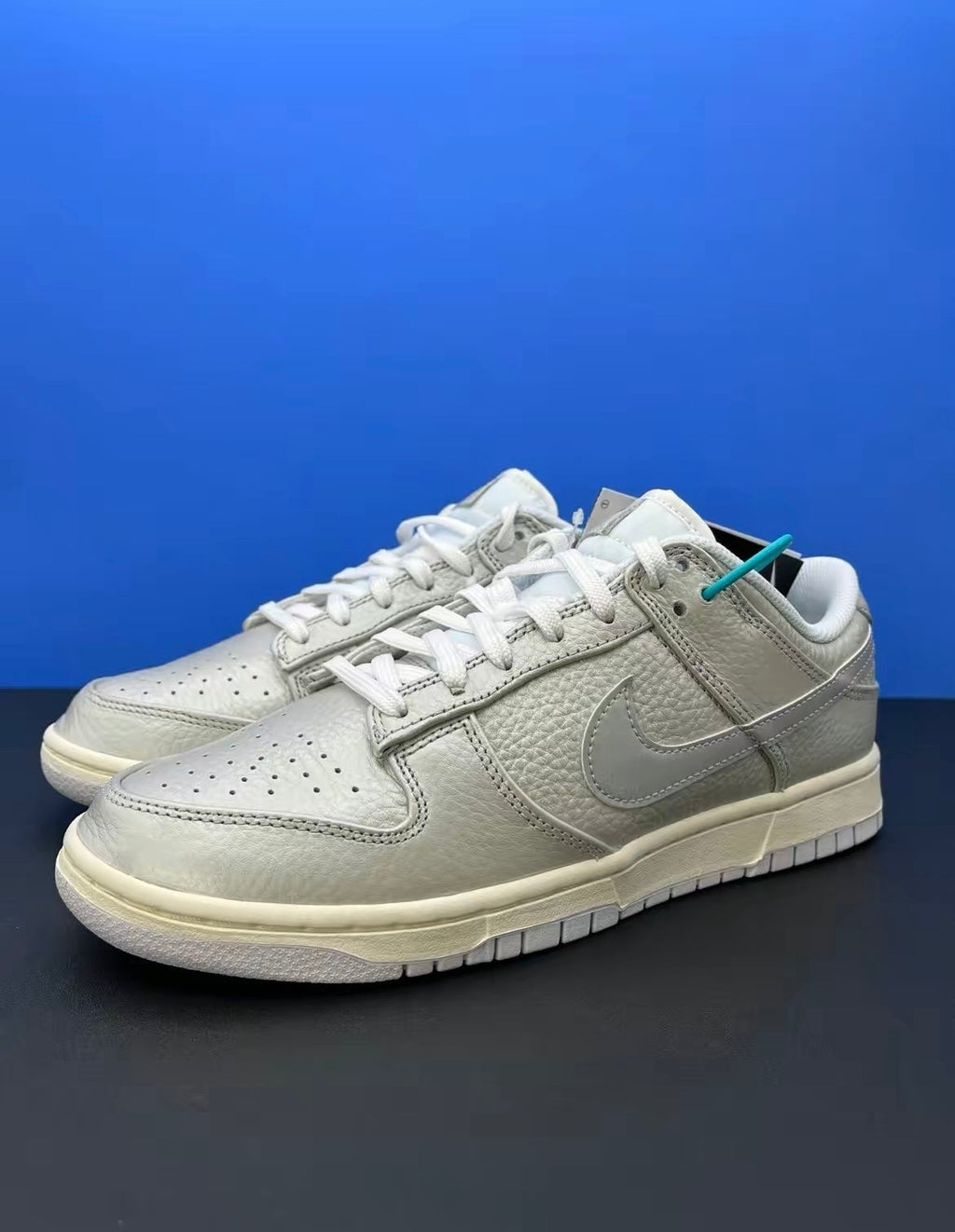 Nike Dunk Low Sneakers in Metallic Silver DX3197-095 - product image from the listing.