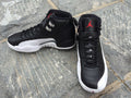 Women's Air Jordan 12 High-Top Sneakers, Black and White - product image from the listing.