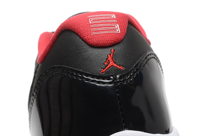 Air Jordan 11 Retro Low Black Red Sneakers - product image from the listing.