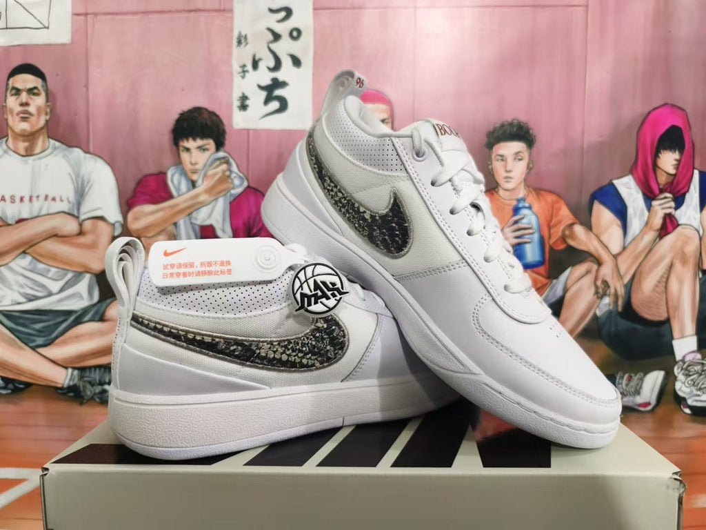 Nike Basketball Trainers in White with Patterned Swoosh - product image from the listing.