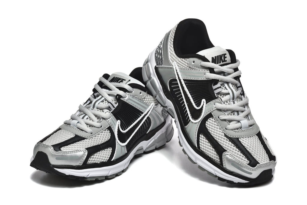 Nike Silver and Black Mesh Trainers - product image from the listing.