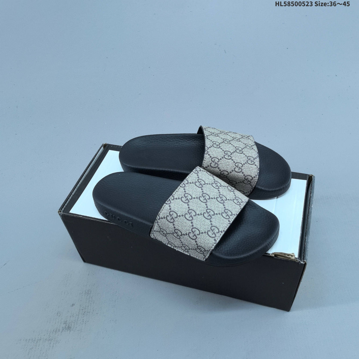 HL58500523 Monogram Slide Sandals by Gucci - product image from the listing.