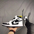 Air Jordan 1 High Sneakers in Black and White - product image from the listing.