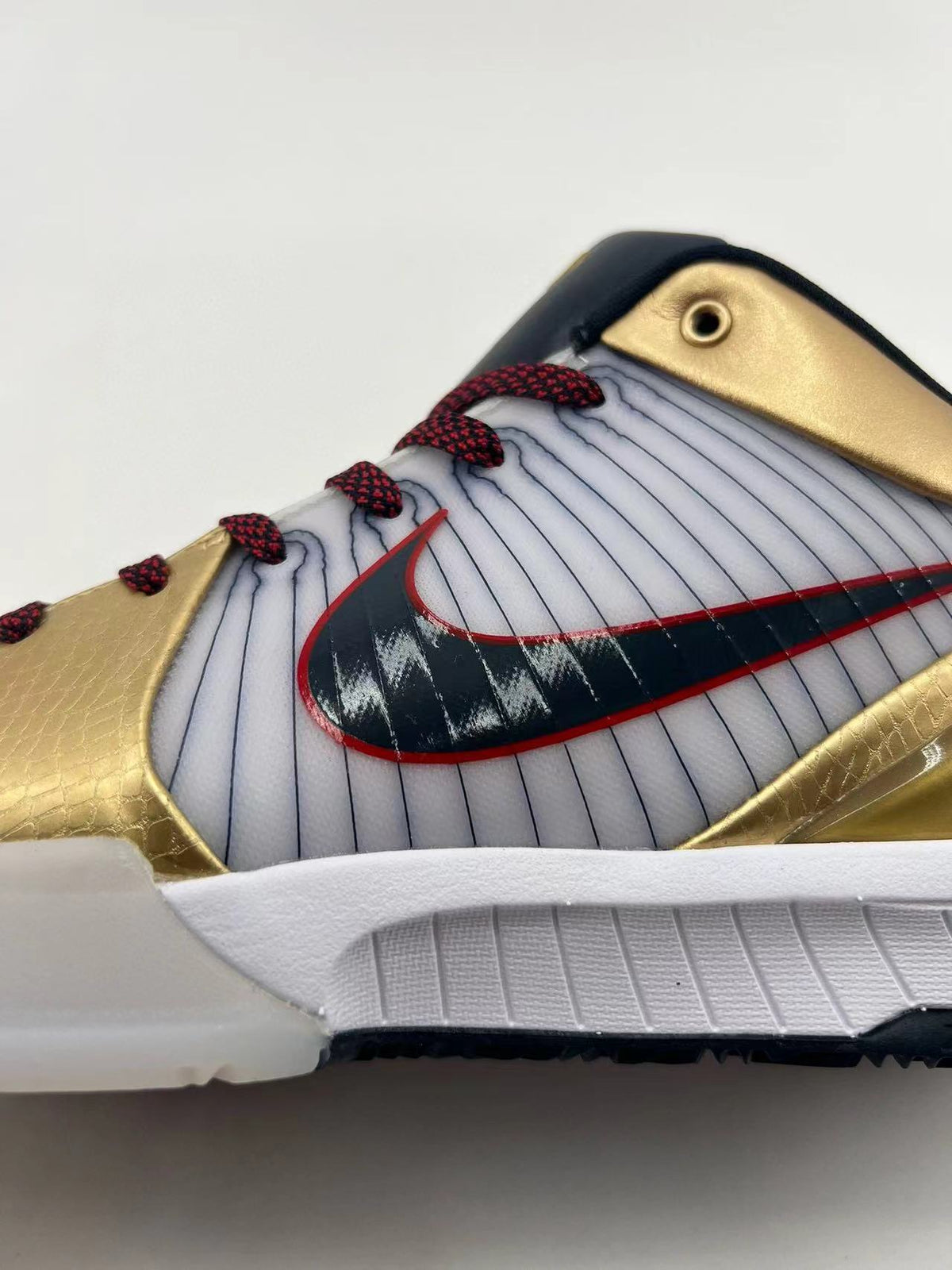 Nike Kobe 4 Protro Sneakers in Gold White 344335-141 - product image from the listing.